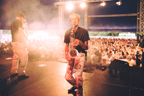 Madness tribute band 'Badness' Performing at a live venue bowing to their audience Saxophone Shot